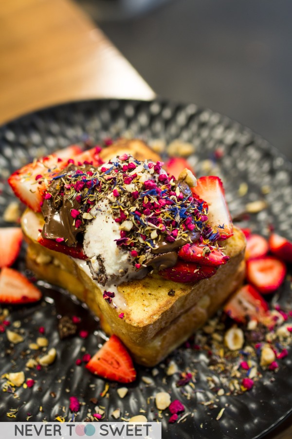 Brioche French Toast with peanut butter, strawberry jam, Nutella, Chocolate cookie crumbs and hazelnuts $16.50